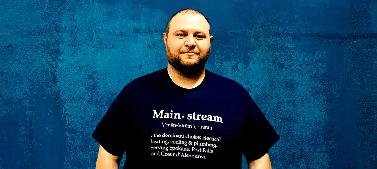 A Mainstream technician wearing a "Mainstream" shirt