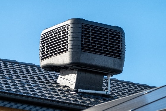 A photo of a swamp cooler on a home