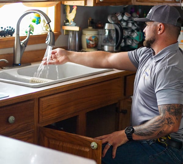 Mainstream plumber installs new kitchen faucet