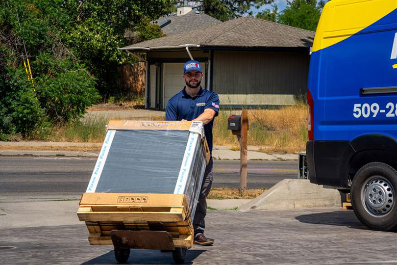 HVAC tech with a new home heating system