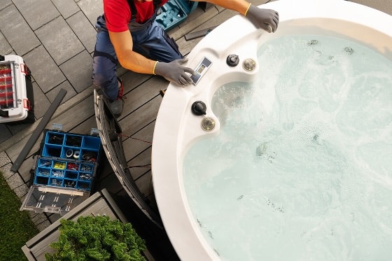 A technician repairing a hot tub