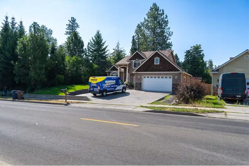 The Mainstream Home Services van parked in a home's driveway on a sunny day in Spokane.