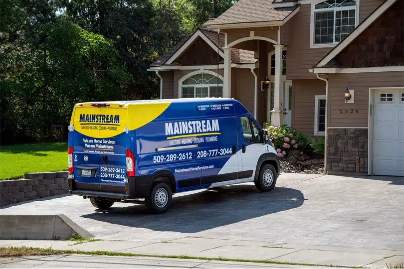 The new Mainstream Home Service van parked in a home's driveway
