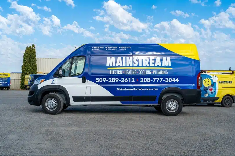 The new Mainstream Electric, Heating, Cooling, & Plumbing van parked in a parking lot.