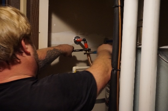 Mainstream Plumber Connects Water Heater