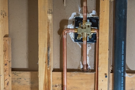 Exposed copper pipes in a home for a whole home repiping job