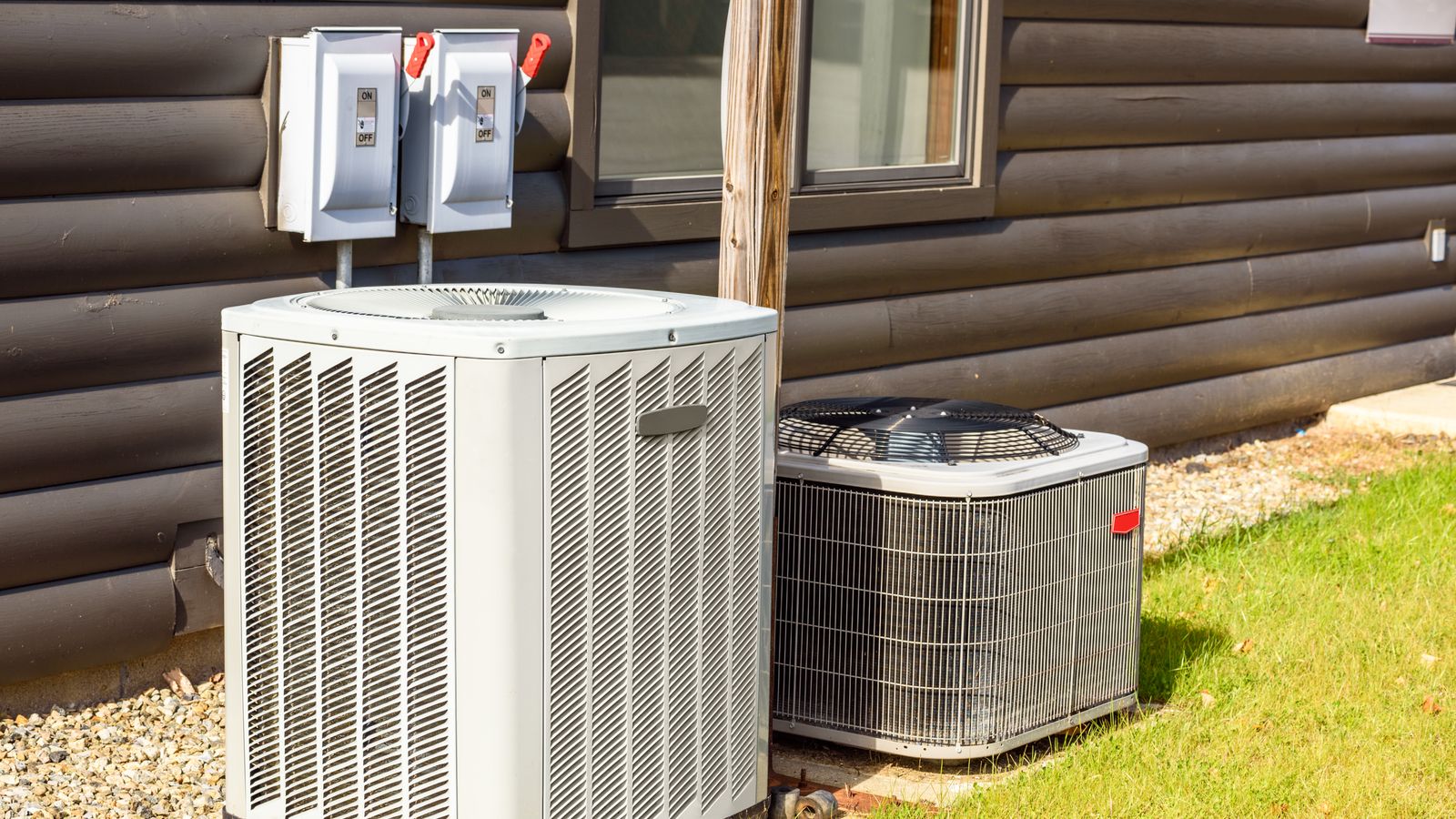 Two AC units outside of a home.