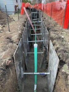 Trench with new sewer pipe installation during drain project in Coeur d'Alene