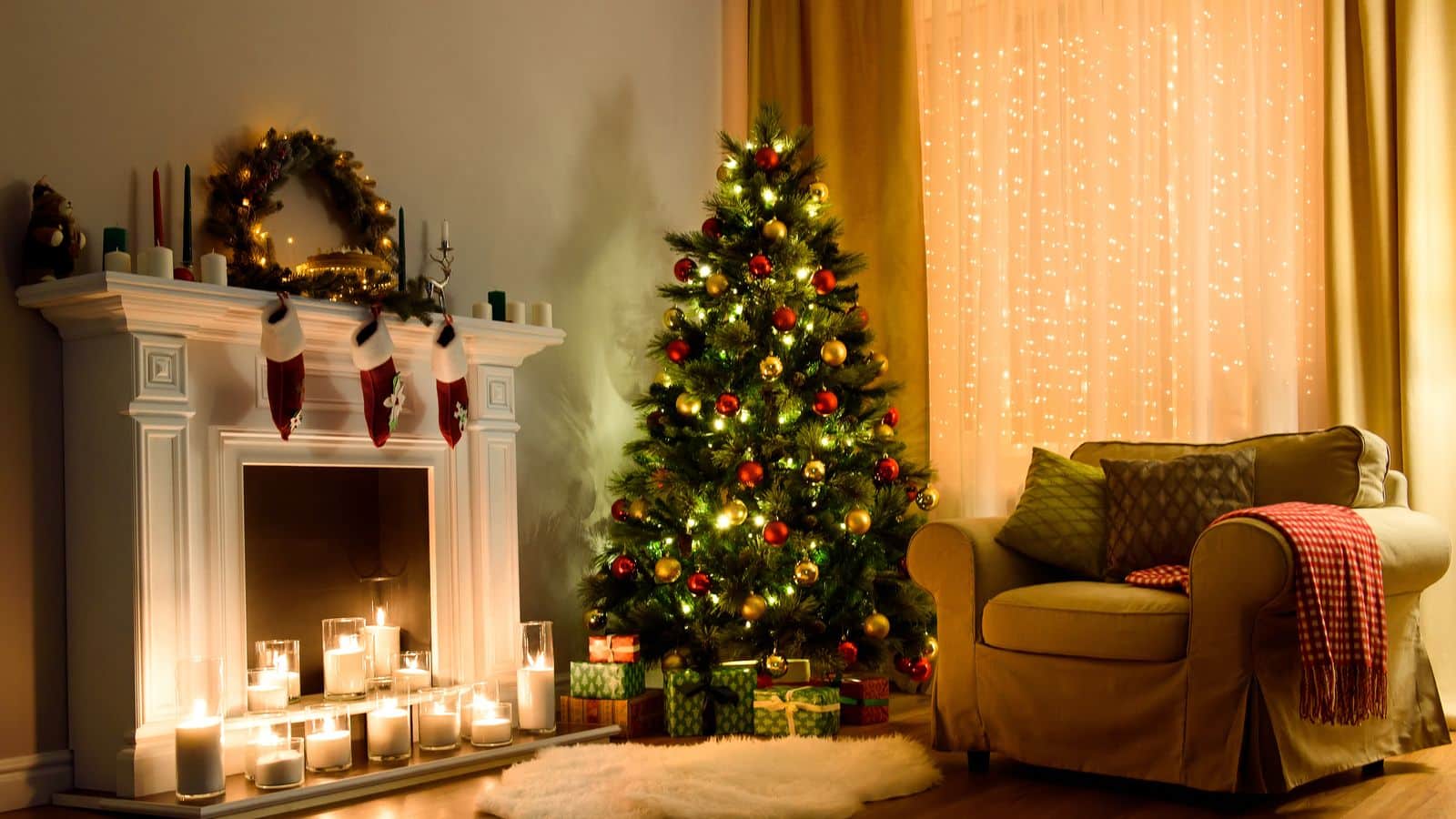 A Christmas Tree decorated in a living room by the fire.