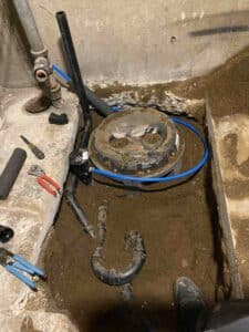 Drain pipes reconnected to the sewage ejector basin.