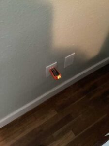 Testing an electrical outlet for power in a home in CDA Idaho
