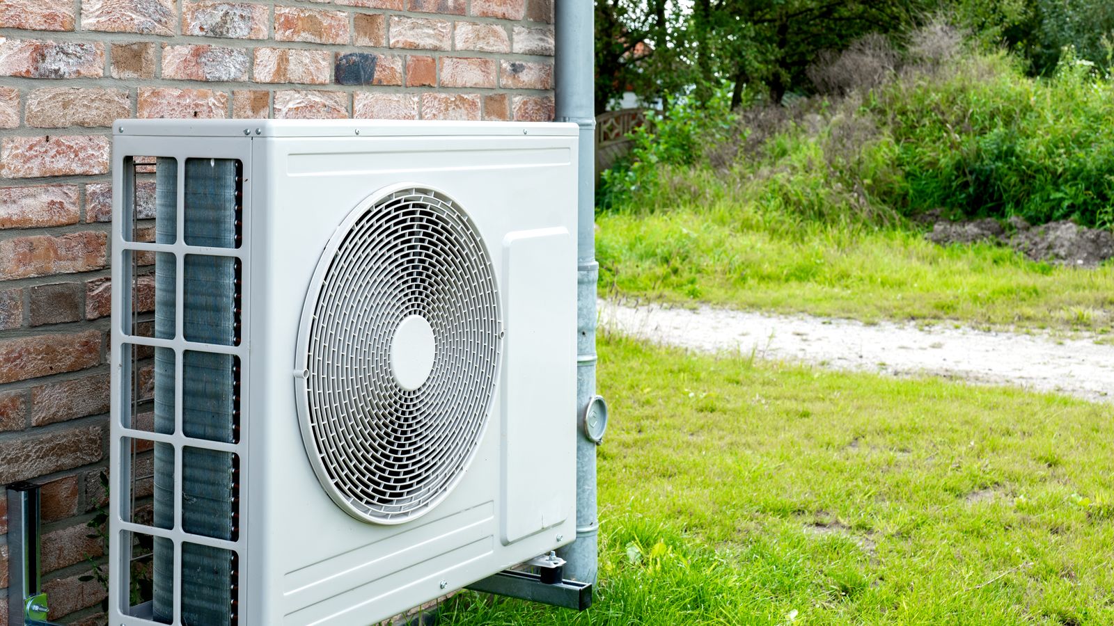 Heat pump compressor outside a home