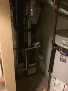 Newly installed high-efficiency furnace inside residential utility closet in Spokane home