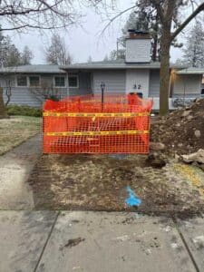 Safety precautions take around a trenched plumbing excavation in Spokane WA