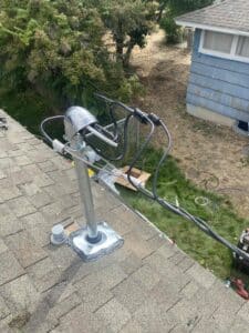 Service mast and weatherhead on roof