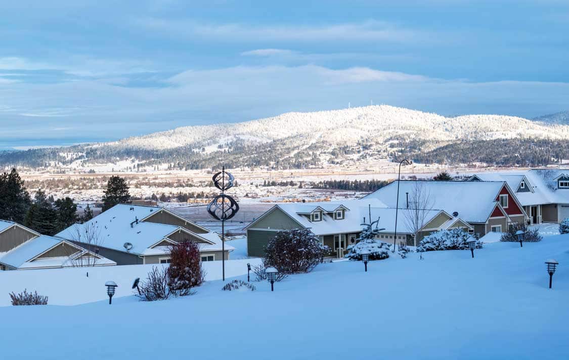 Overlooking Spokane Valley neighborhood homes covered in snow