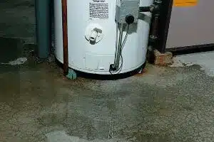 Water pooling from a water heater leak.