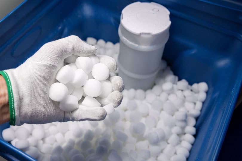 A container of salt used in a water softener system.
