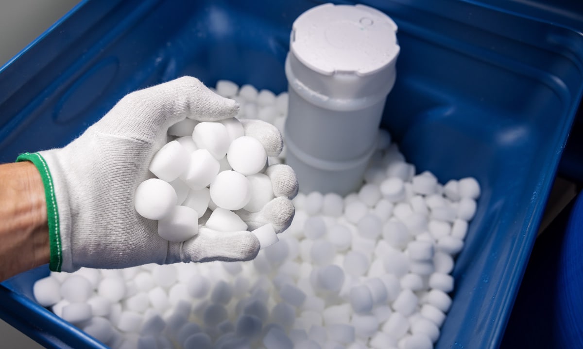 A container of salt used in a water softener system.